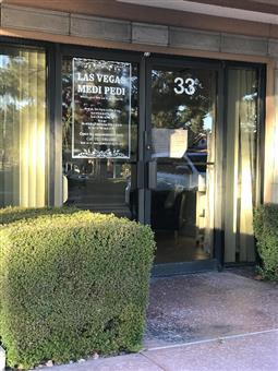 Clean, professional medical spa treatment room with neutral tones at Las Vegas Medi Pedi Center & Spa LLC in Henderson